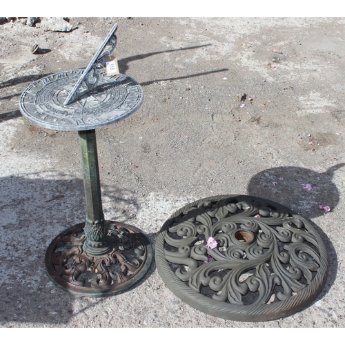 318 - Garden sundial on post and a parasol base, the sundial approx 81cm tall x 36cm in diameter (2)