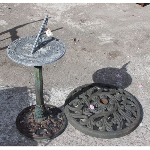 318 - Garden sundial on post and a parasol base, the sundial approx 81cm tall x 36cm in diameter (2)