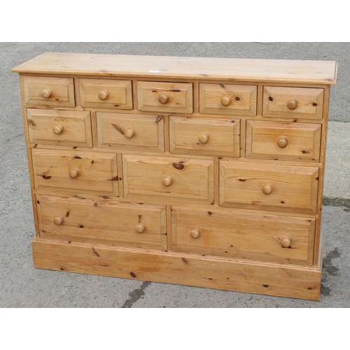 24 - An unusual modern pine 14 drawer chest of drawers, approx 126cm wide x 33cm deep x 92cm tall