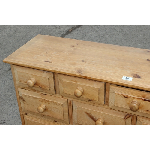 24 - An unusual modern pine 14 drawer chest of drawers, approx 126cm wide x 33cm deep x 92cm tall