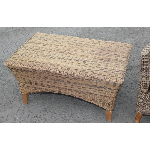 26 - A wicker conservatory 2 seater sofa and a small matching table, sofa approx 120cm wide