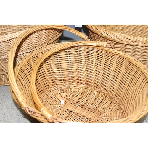 270 - 3 wicker baskets to incl 2 laundry baskets and a shopping basket, largest approx 65cm wide