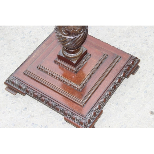 29 - A large vintage carved mahogany torchiere or candle stand, approx 138cm tall