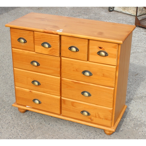 33 - An unusual contemporary pine 10 drawer chest of drawers, approx 91cm wide x 39cm deep x 80cm tall