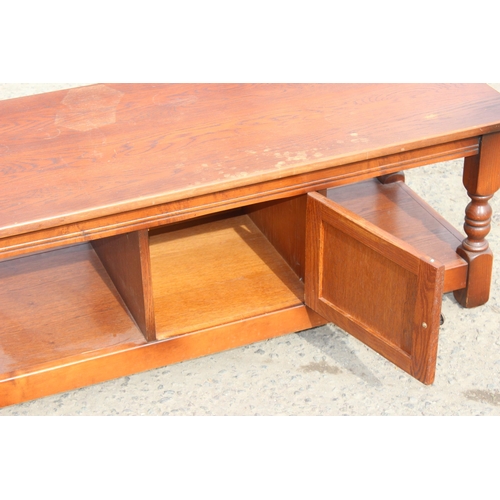 34 - A vintage oak coffee table, possibly Old Charm, approx 121cm wide x 51cm deep x 47cm tall