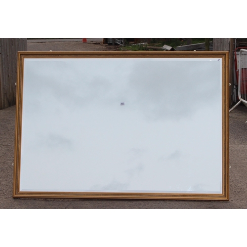 417 - An extremely large gilt framed wall mirror, approx 195cm x 135cm