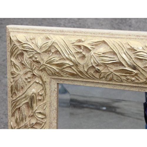 418 - A large gilt framed wall mirror with highly decorative frame, approx 120cm x 93cm