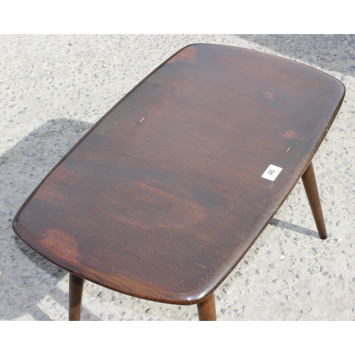 46 - A retro Ercol coffee table, dark finish, approx 72cm wide x 45cm deep x 45cm tall