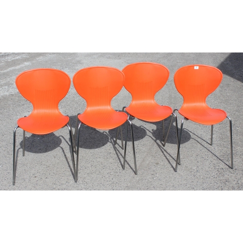 57 - A set of 4 retro style orange plastic and chrome chairs, approx 53cm wide x 51cm deep x 83cm tall