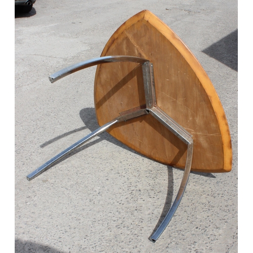 59 - In the manner of Marc Berthier, a retro Tucano style dining table with wooden top and chrome legs, a... 