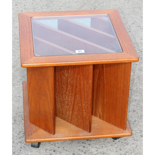 61 - A retro teak and glass topped record rack side table, approx 51cm wide x 51cm deep x 50cm tall