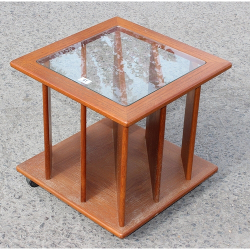 61 - A retro teak and glass topped record rack side table, approx 51cm wide x 51cm deep x 50cm tall