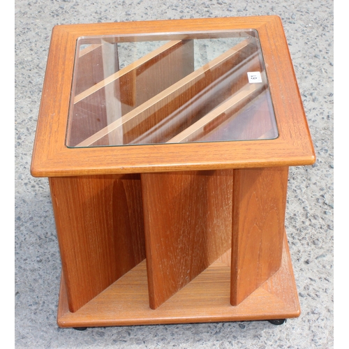 61 - A retro teak and glass topped record rack side table, approx 51cm wide x 51cm deep x 50cm tall