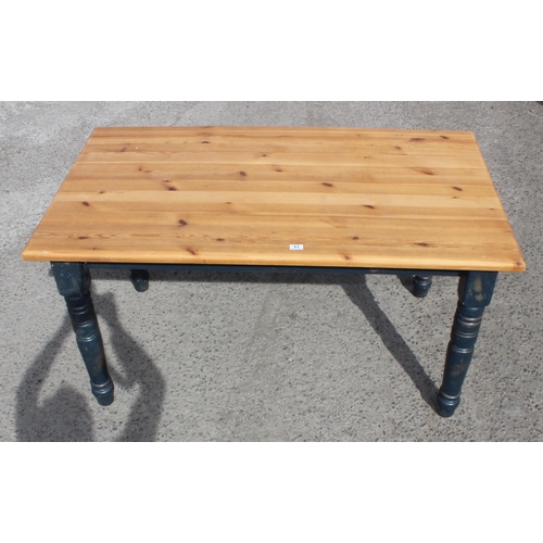 63 - A vintage pine farmhouse kitchen table with painted base, approx 150cm wide x 85cm deep x 76cm tall