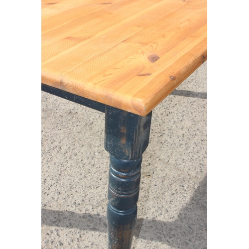 63 - A vintage pine farmhouse kitchen table with painted base, approx 150cm wide x 85cm deep x 76cm tall