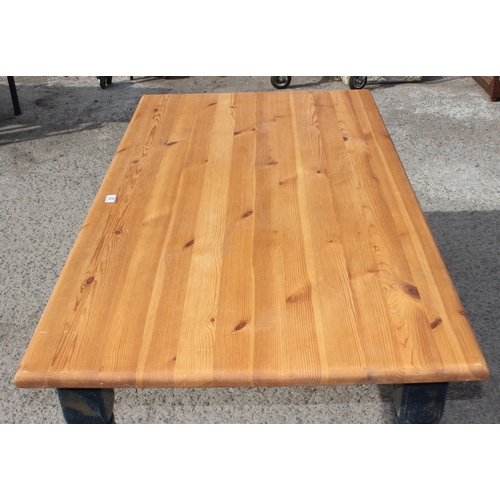 63 - A vintage pine farmhouse kitchen table with painted base, approx 150cm wide x 85cm deep x 76cm tall