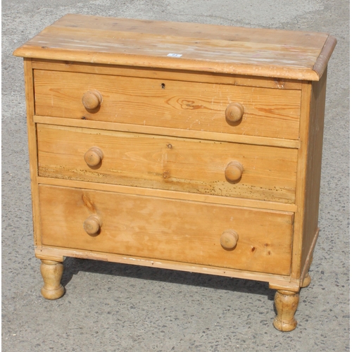 64 - An antique pine 3 drawer chest of drawers with turned wooden feet and handles, approx 88cm wide x 41... 