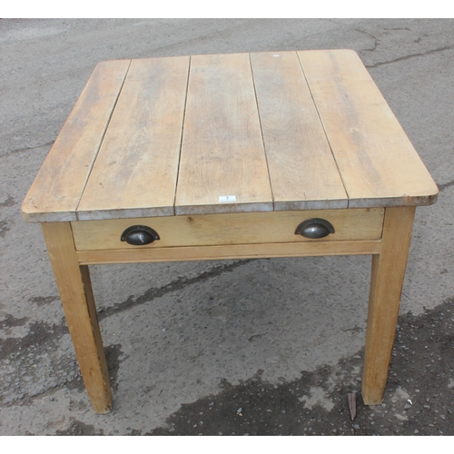 7 - A rustic pine farmhouse kitchen table with long single drawer and 5 plank top, approx 116cm wide x 9... 