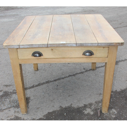 7 - A rustic pine farmhouse kitchen table with long single drawer and 5 plank top, approx 116cm wide x 9... 