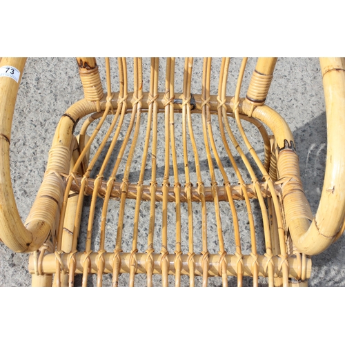 73 - In the manner of Franco Albini, a retro bamboo rocking chair, approx 57cm wide x 83cm deep x 115cm t... 