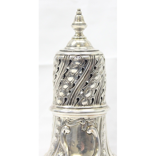 1029 - A large Victorian silver embossed sugar caster, highly decorative, marked for London 1888 by Sibray,... 