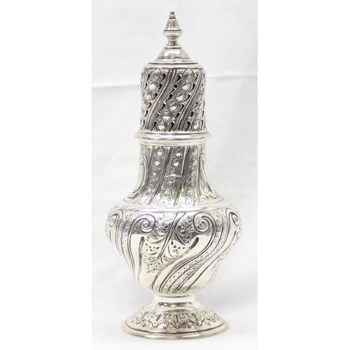 1029 - A large Victorian silver embossed sugar caster, highly decorative, marked for London 1888 by Sibray,... 