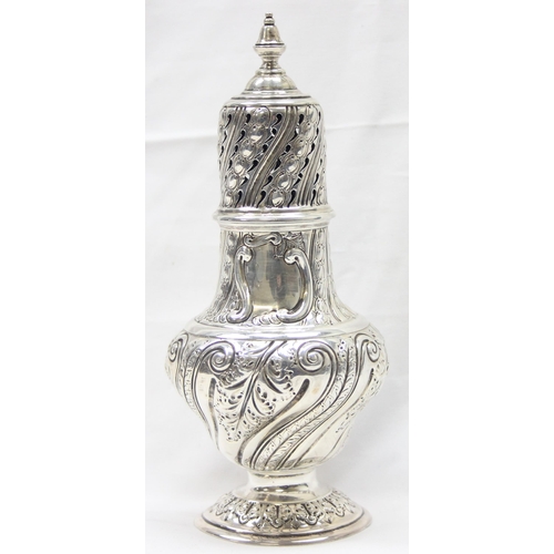 1029 - A large Victorian silver embossed sugar caster, highly decorative, marked for London 1888 by Sibray,... 