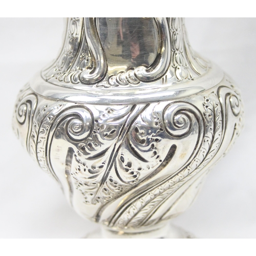 1029 - A large Victorian silver embossed sugar caster, highly decorative, marked for London 1888 by Sibray,... 