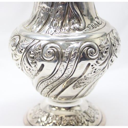 1029 - A large Victorian silver embossed sugar caster, highly decorative, marked for London 1888 by Sibray,... 