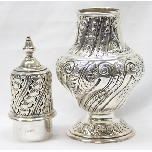 1029 - A large Victorian silver embossed sugar caster, highly decorative, marked for London 1888 by Sibray,... 