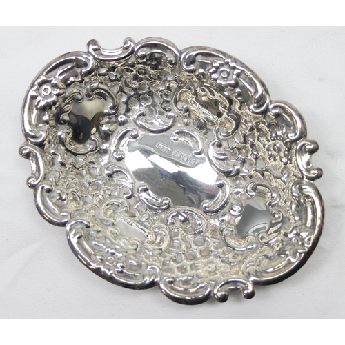 1030 - A pair of heavy gauge antique style embossed silver pin dishes, London 1971 by Richards & Knight, ea... 