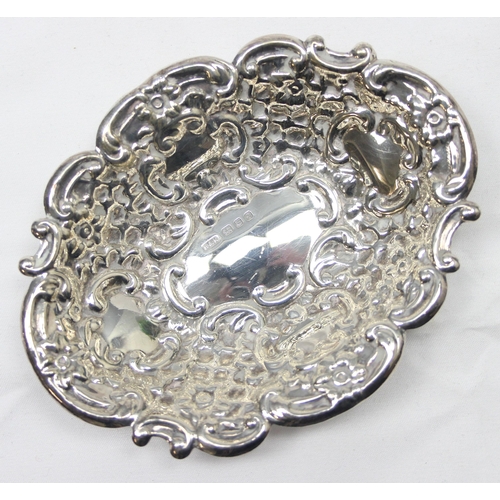 1030 - A pair of heavy gauge antique style embossed silver pin dishes, London 1971 by Richards & Knight, ea... 