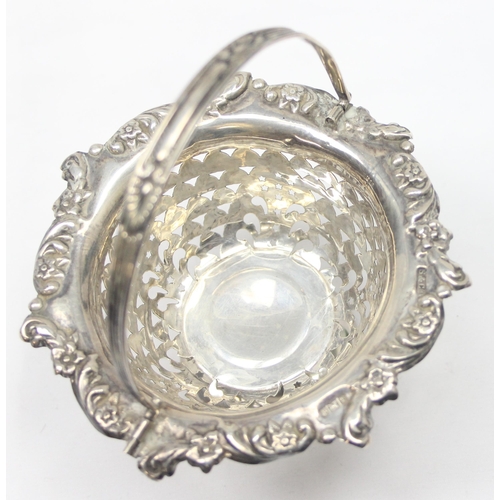 1031 - An Edwardian miniature silver swing handled basket with pierced and engraved design, Birmingham 1903... 