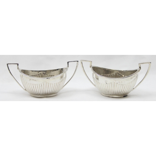 1041 - A pair of Victorian silver salts of canoe shape and gadrooned design, Chester 1899 & Birmingham 1898... 