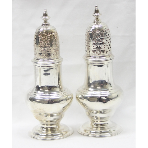 1042 - A pair of George II period silver pepper pots, London 1748 by Samuel Wood, each approx 13cm tall, ap... 