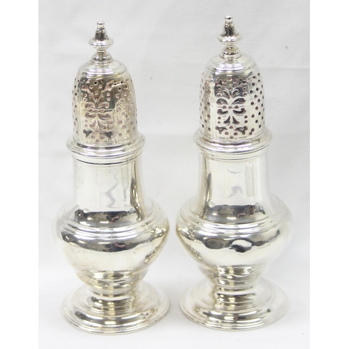 1042 - A pair of George II period silver pepper pots, London 1748 by Samuel Wood, each approx 13cm tall, ap... 