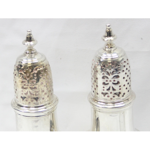 1042 - A pair of George II period silver pepper pots, London 1748 by Samuel Wood, each approx 13cm tall, ap... 