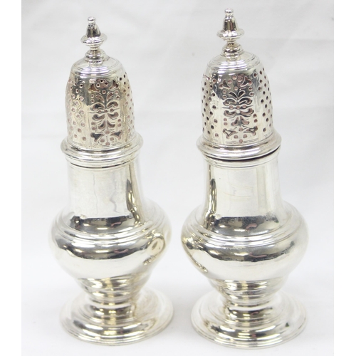 1042 - A pair of George II period silver pepper pots, London 1748 by Samuel Wood, each approx 13cm tall, ap... 