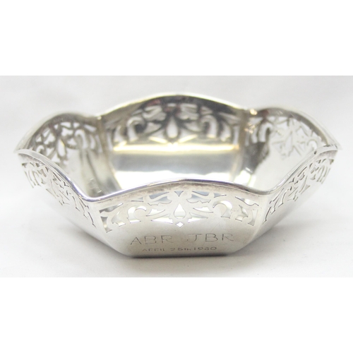 1043 - A vintage silver bowl of hexagonal form with pierced border, Birmingham hallmark but date letter rub... 