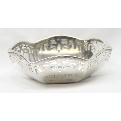 1043 - A vintage silver bowl of hexagonal form with pierced border, Birmingham hallmark but date letter rub... 