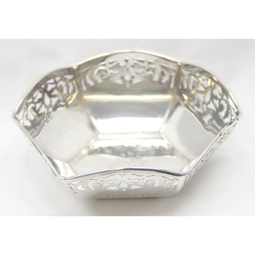 1043 - A vintage silver bowl of hexagonal form with pierced border, Birmingham hallmark but date letter rub... 