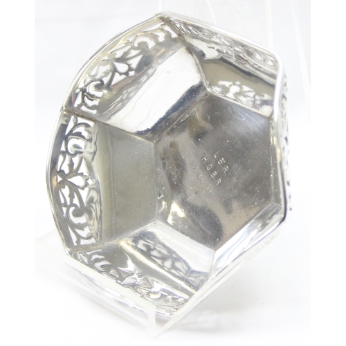 1043 - A vintage silver bowl of hexagonal form with pierced border, Birmingham hallmark but date letter rub... 