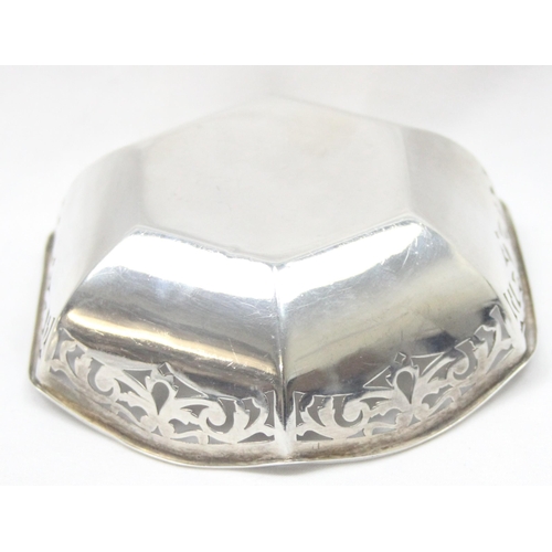 1043 - A vintage silver bowl of hexagonal form with pierced border, Birmingham hallmark but date letter rub... 