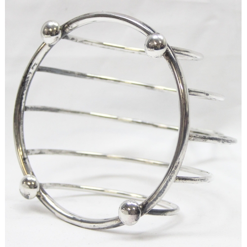 1047 - An Art Deco style round silver 4 slice toast rack, Birmingham 1995 by Broadway & Co, approx 11cm tal... 