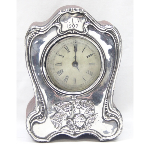 1049 - An Edwardian silver fronted mantel or desk clock decorated with Reynolds Angels, Birmingham 1905 by ... 