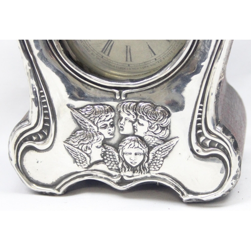 1049 - An Edwardian silver fronted mantel or desk clock decorated with Reynolds Angels, Birmingham 1905 by ... 