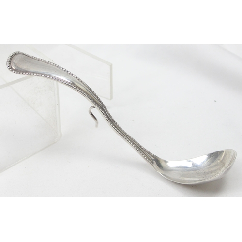 1059 - An unusual vintage Dutch silver pickle or preserve spoon with hanging hook, fully marked and XRF con... 