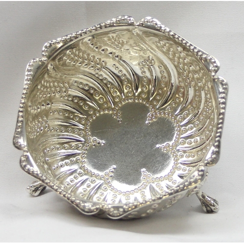 1060 - A Victorian silver sugar bowl with 3 pad feet and unusual embossed decoration, London 1881 by Henry ... 