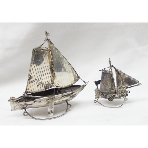 1065 - 2 small silver models of Oriental boats, both indistinctly marked but both XRF confirmed to be 85% p... 