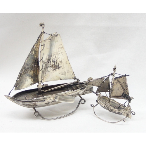 1065 - 2 small silver models of Oriental boats, both indistinctly marked but both XRF confirmed to be 85% p... 